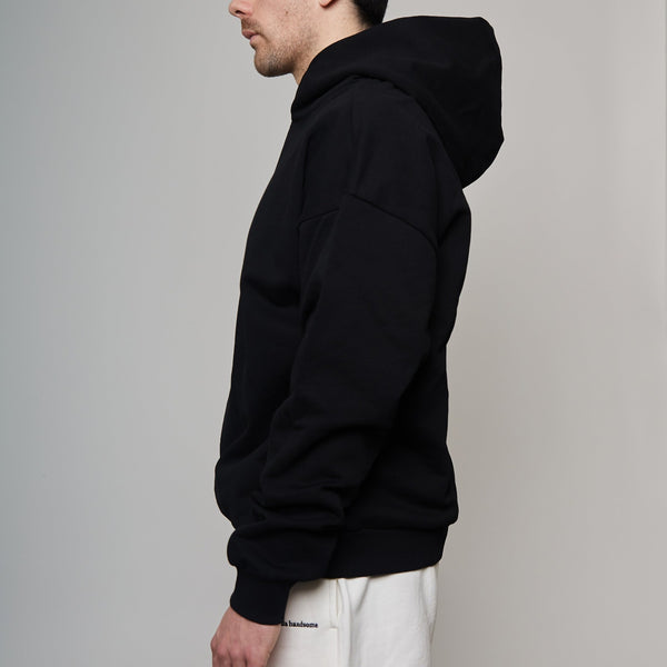 side of black hoodie showing drop shoulder